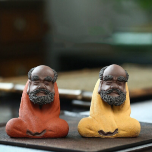 Handcrafted purple clay Bodhidharma zen tea pet main view, yellow color