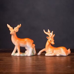 Handcrafted ceramic lucky deer tea pet set displayed on wooden table