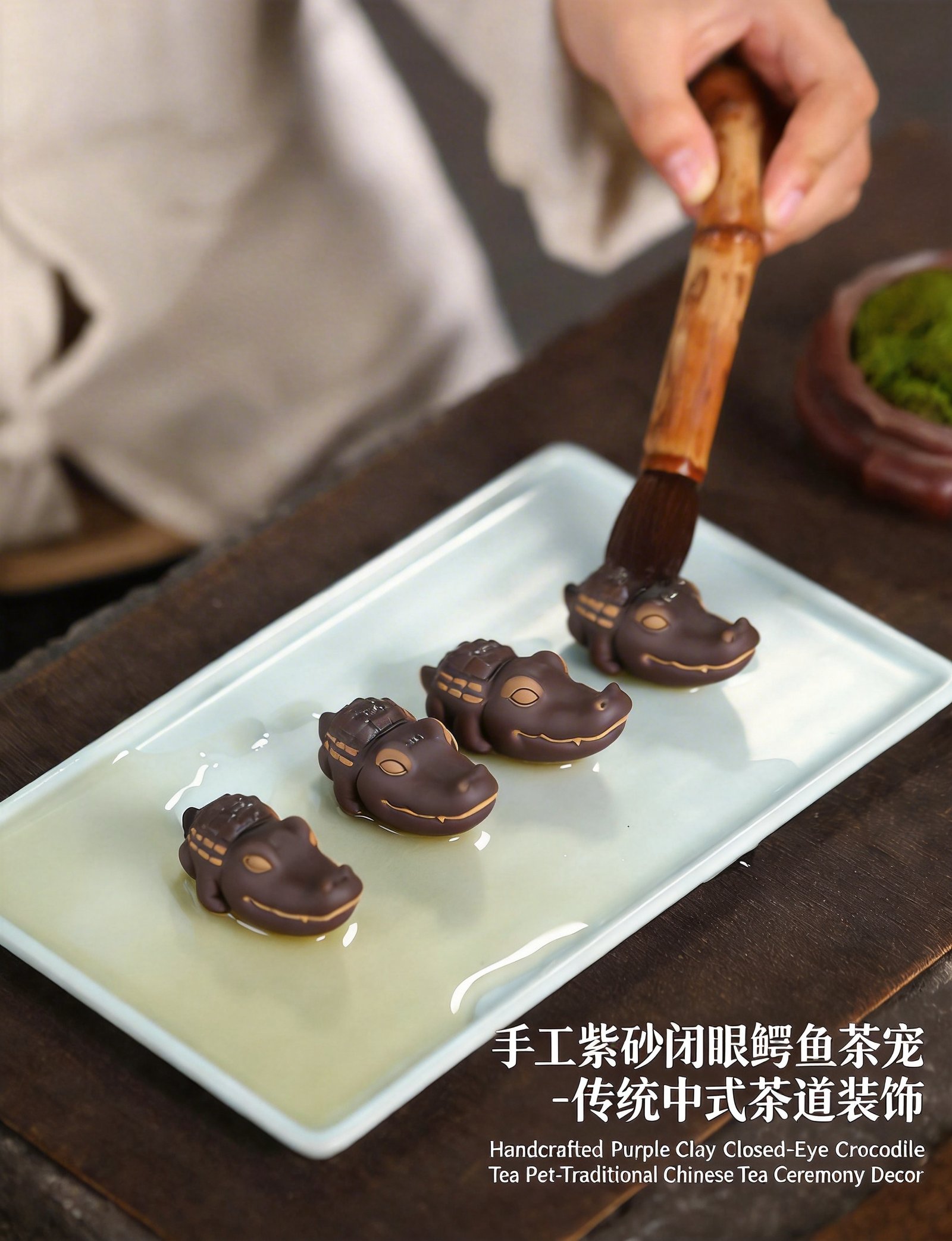 Brushing tea onto purple clay crocodile tea pet with bamboo tea brush
