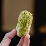 Main view of handcrafted lucky cabbage purple clay tea pet on tea tray