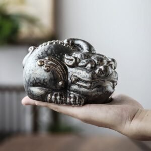 Main view of handcrafted retro pixiu ceramic tea pet with antique bronze finish