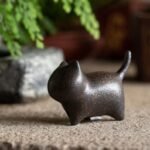 Main view of rustic handcrafted ceramic cat tea pet with vintage finish