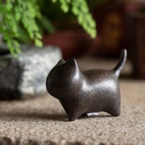 Main view of rustic handcrafted ceramic cat tea pet with vintage finish