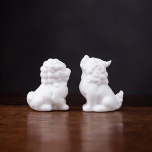 Main view of handcrafted white ceramic lucky lion tea pet on wooden table