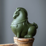 Main view of handcrafted Yixing clay warhorse tea pet in warm beige color