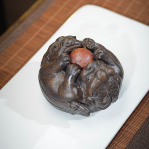 Hand carved Yixing zisha double Pixiu tea pet main view on bamboo tea mat