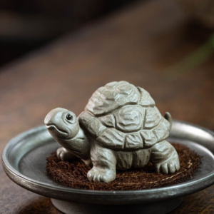 Handcrafted Yixing zisha turtle tea pet main view on wooden tea table
