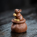 Handcrafted Yixing zisha wealth mouse tea pet main view with gold ingot
