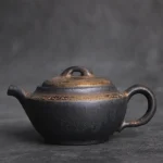 front view of 190ml handcrafted black gilded ceramic chinese teapot