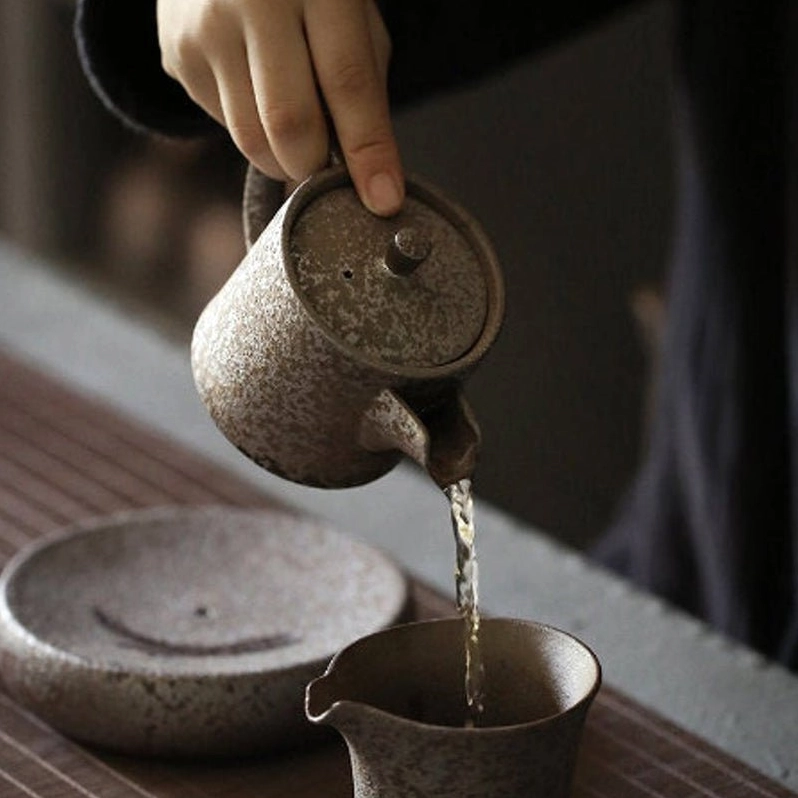 pouring tea from 200ml iron rust glaze ceramic tea pot