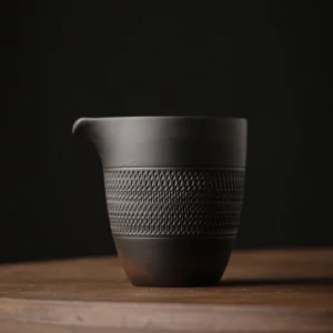 front view of 220ml textured black zisha purple clay gong dao bei fairness cup