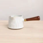 full view of 230ml white ceramic gong dao bei with wooden handle