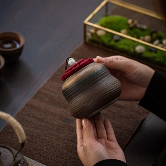 250ml medium ceramic tea jar next to a tea cup for size reference