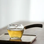 full view of 250ml hammered glass gong dao bei with wood handle