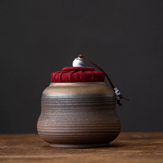 Close up of cord and ceramic bead seal on airtight tea jar lid