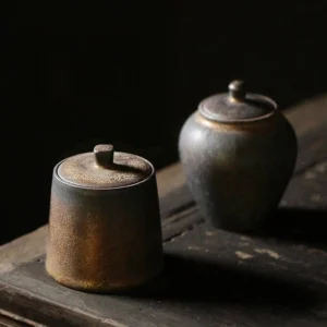 Full view of antique style handcrafted ceramic Chinese tea jar on wooden background