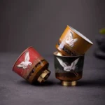 auspicious red-crowned crane ceramic tea cup with copper base front view