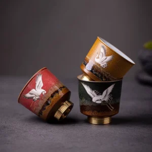 auspicious red-crowned crane ceramic tea cup with copper base front view