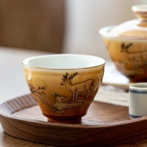 Full product view of handcrafted ceramic chawan tea bowl with auspicious deer pattern