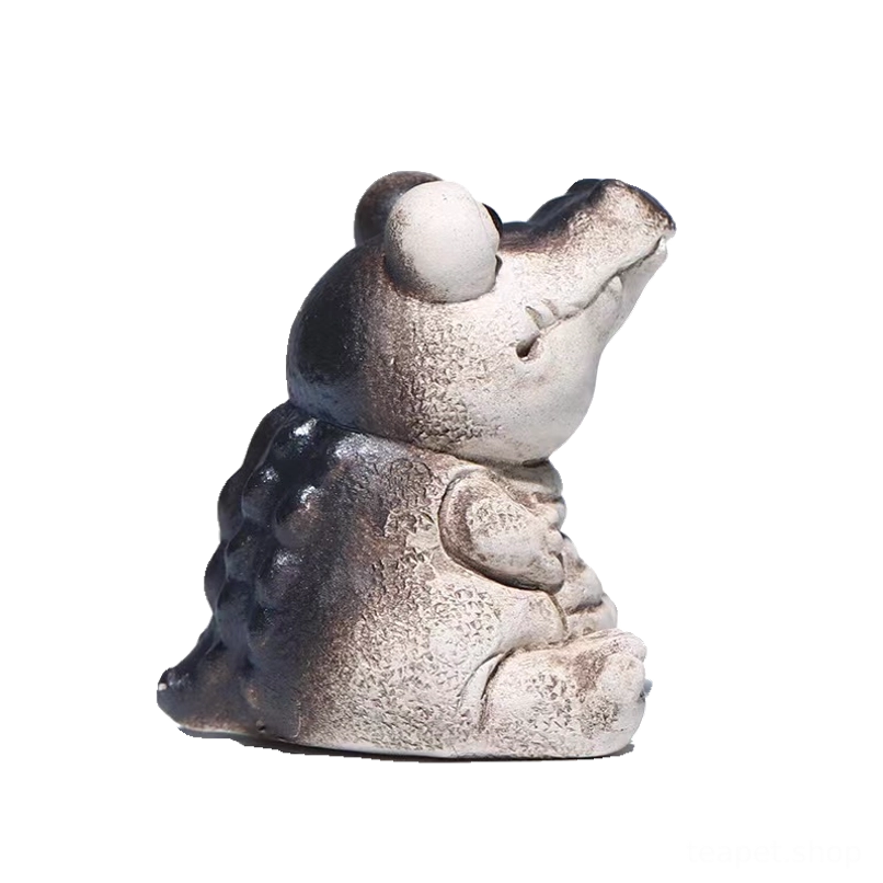 close up of face details on big-eye crocodile tea pet