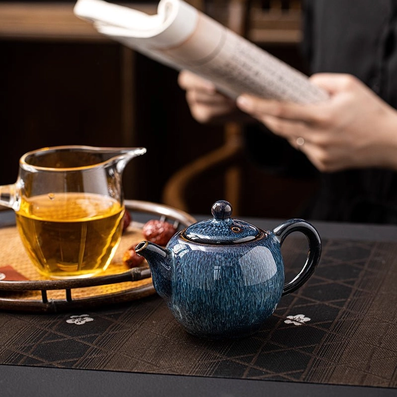 bottom base of blue ceramic teapot view