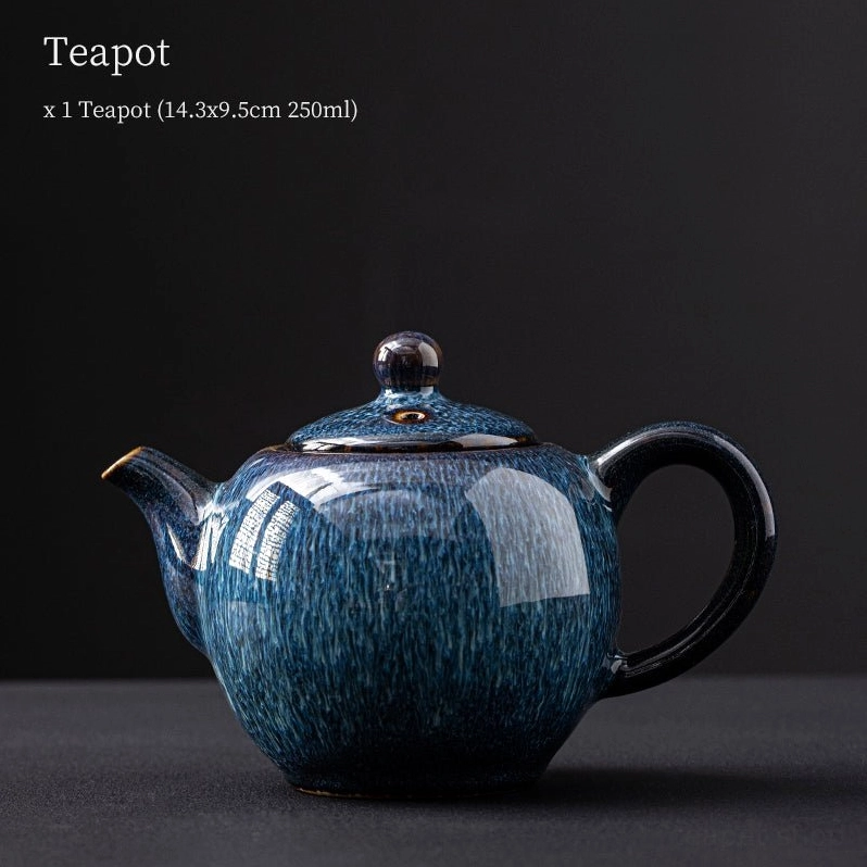 side angle view of unique blue glazed ceramic teapot
