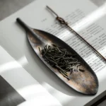 handmade bodhi leaf ceramic tea scoop on wooden tea table