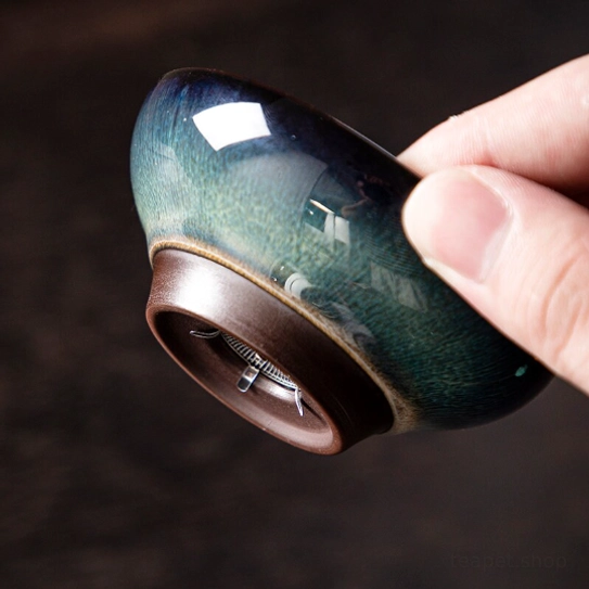 side view of ceramic loose leaf tea strainer showing its tapered shape