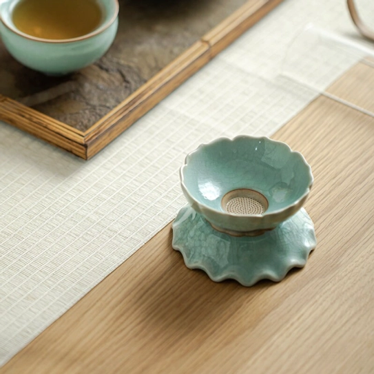 close up of fine filter holes on ceramic lotus loose leaf tea strainer