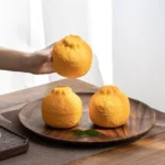 handmade ceramic orange loose leaf tea strainer full product view