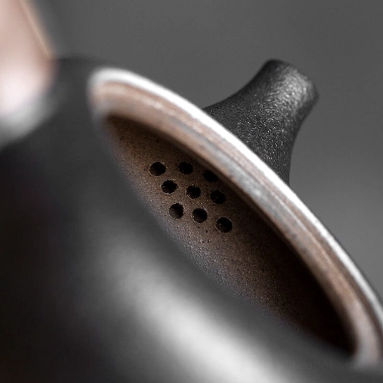close up of built-in filtration holes on ceramic kyusu teapot