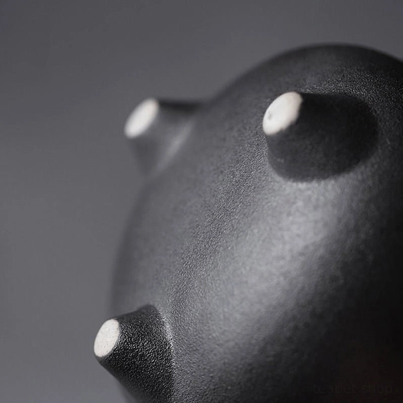 Close up of cotton wrapped handle on handcrafted ceramic teapot