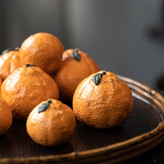 Close up of realistic orange tea pet showing dimpled skin texture