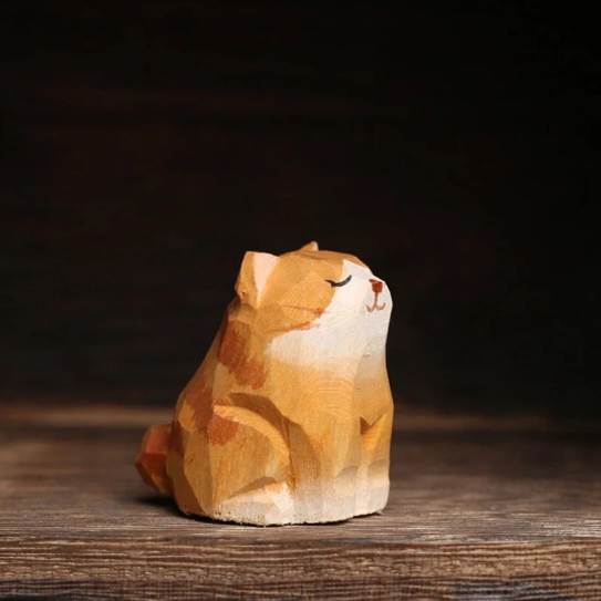 Close up detail of hand-carved wood cat tea pet smiling face