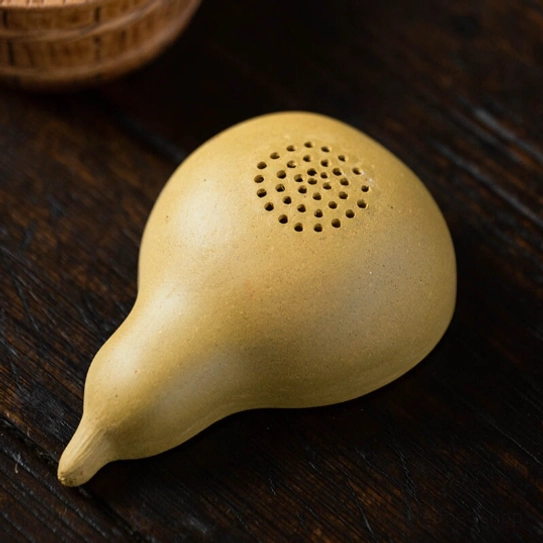 close up of zisha gourd loose leaf tea strainer filter holes