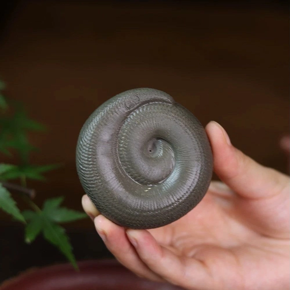 handcrafted coiled snake tea pet on gongfu tea tray
