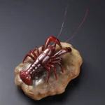handcrafted color changing lobster ceramic tea pet on rock base
