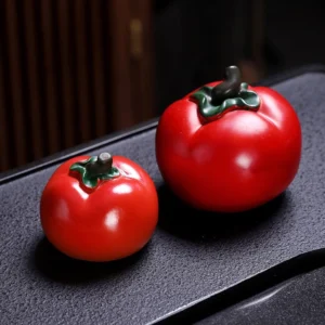 color changing persimmon tea pet on gongfu tea tray