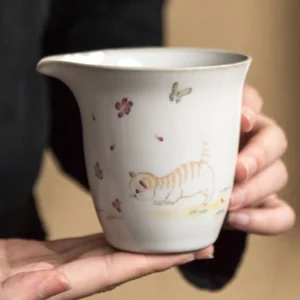 full product view of cute cat hand-patterned ceramic gong dao bei tea pitcher