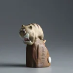 Cute chibi tiger ceramic tea pet with calligraphy base main product view