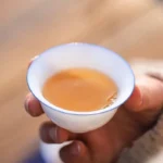 collection of five dehua white porcelain tea cups with blue rim