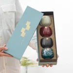 full set of four mixed color chinese ceramic tea cups in blue gift box