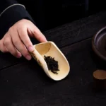 Full view of handcrafted spotted banded bamboo tea scoop