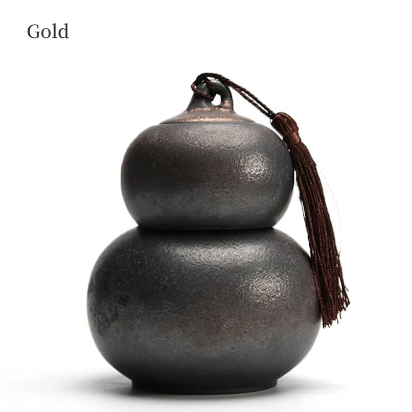 gold colored ceramic gourd tea jar stacked whole view