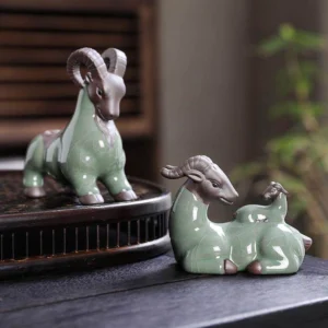 full set of handmade green crackle glaze goat tea pets displayed on wooden tea tray