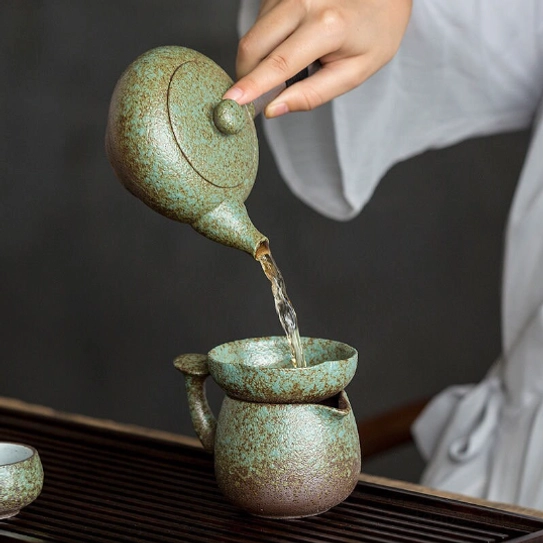 green matte ceramic kyusu side handle teapot display