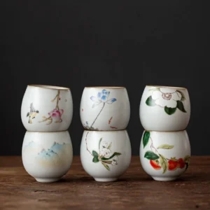 Collection of all 6 styles of hand painted Chinese ceramic tea cups with gold rim