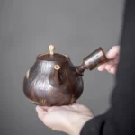 full view of handcrafted 450ml dark brown ceramic kyusu teapot with wood grain texture