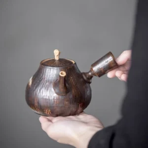full view of handcrafted 450ml dark brown ceramic kyusu teapot with wood grain texture