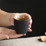 handcrafted black clay tripod tea cup 150ml side view